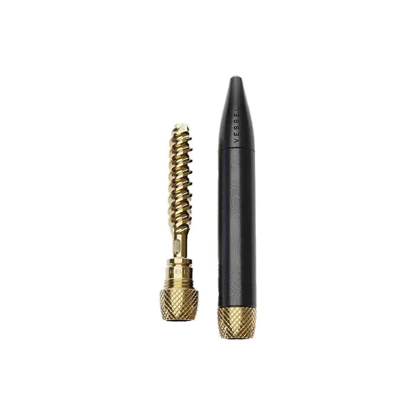 Black and gold cleaning tool for Vessel Helix Dry Herb Vaporizer displayed on product image